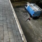 Clogged Gutter Overflowing with Debris